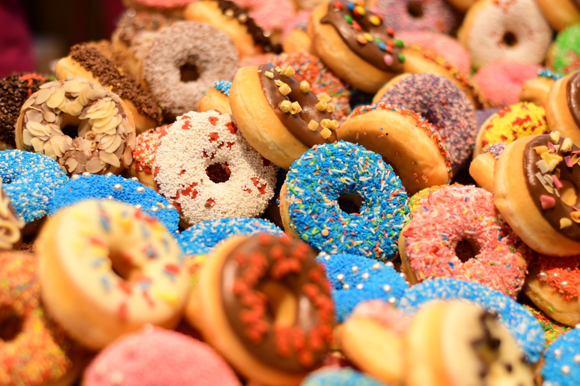 Showcase Full Of Donuts Of Different Colors